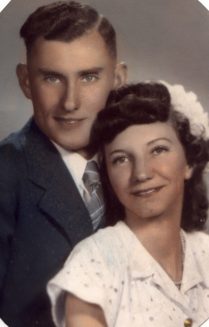 A man and a photo in their wedding pic taken in the 1940s.