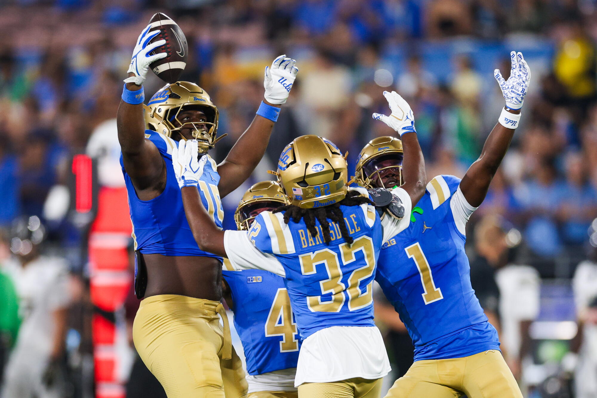 UCLA players celebrate after defensive lineman Sahir West recovers a fumble against Purdue on Sept. 19.
