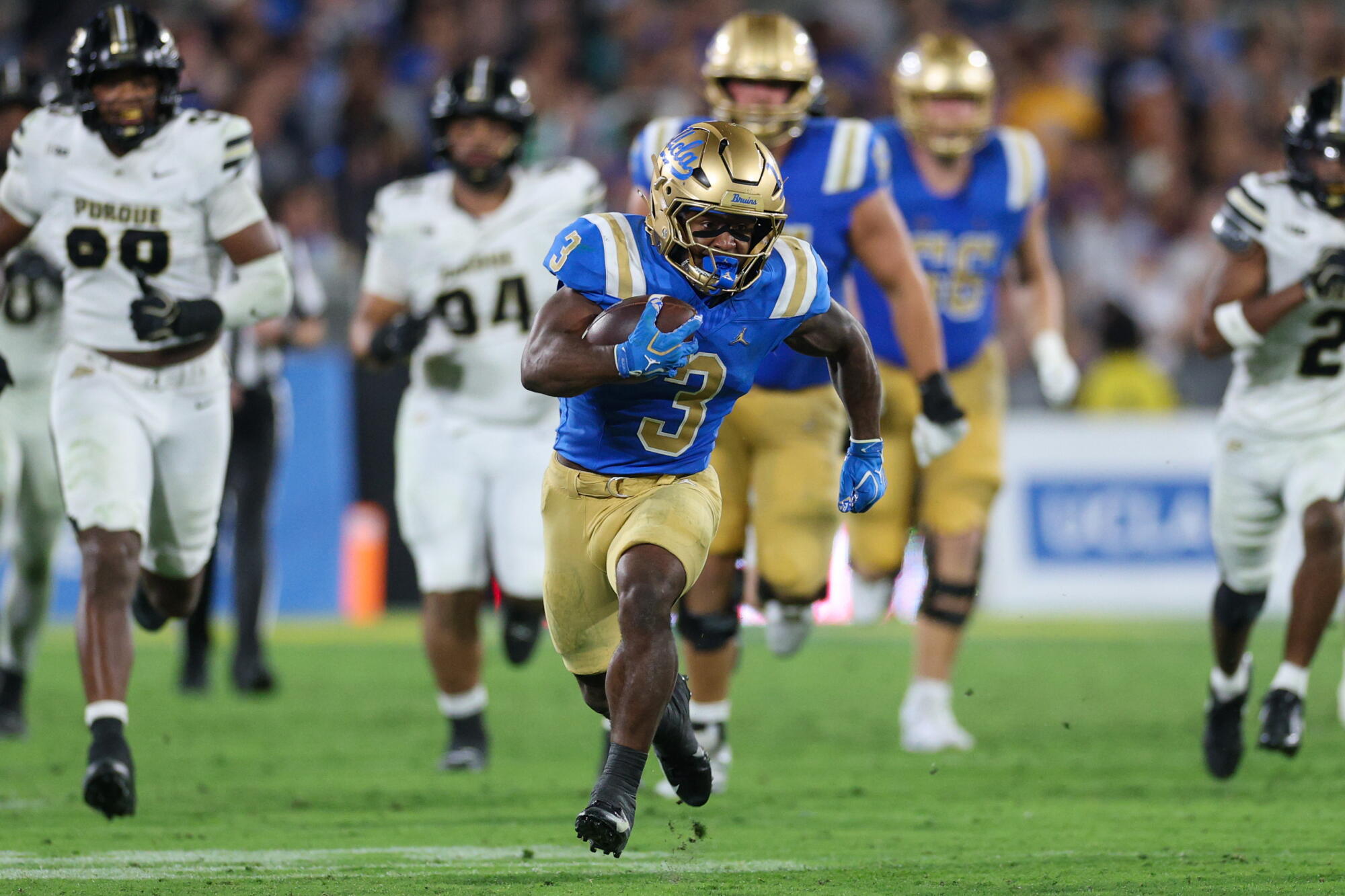 UCLA running back Wayne Knight carries the ball and breaks away from the Purdue defense on Sept. 19.