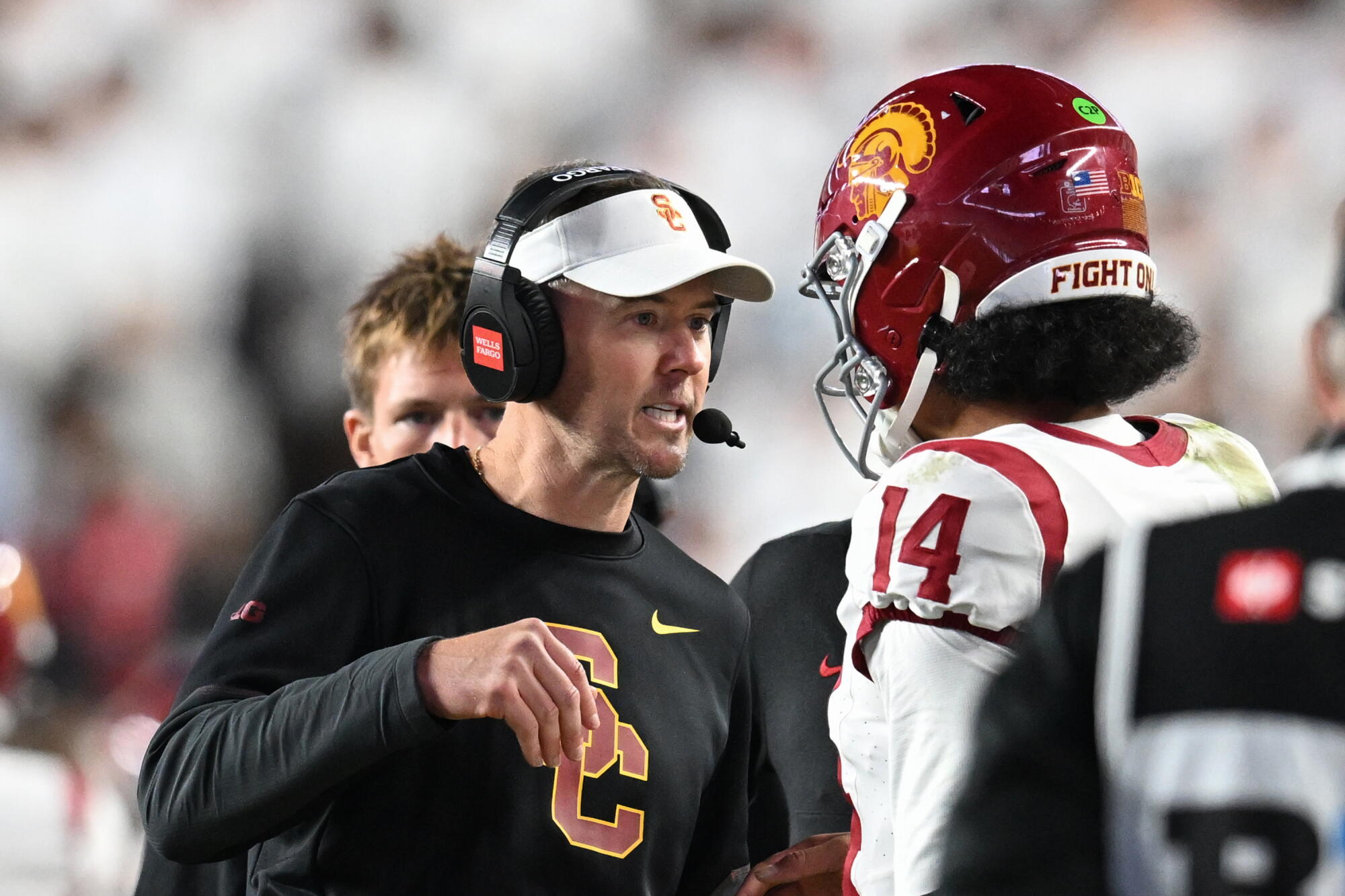 USC coach Lincoln Riley, left, talks with quarterback Jayden Maiava during a 31-23 win over Penn State.