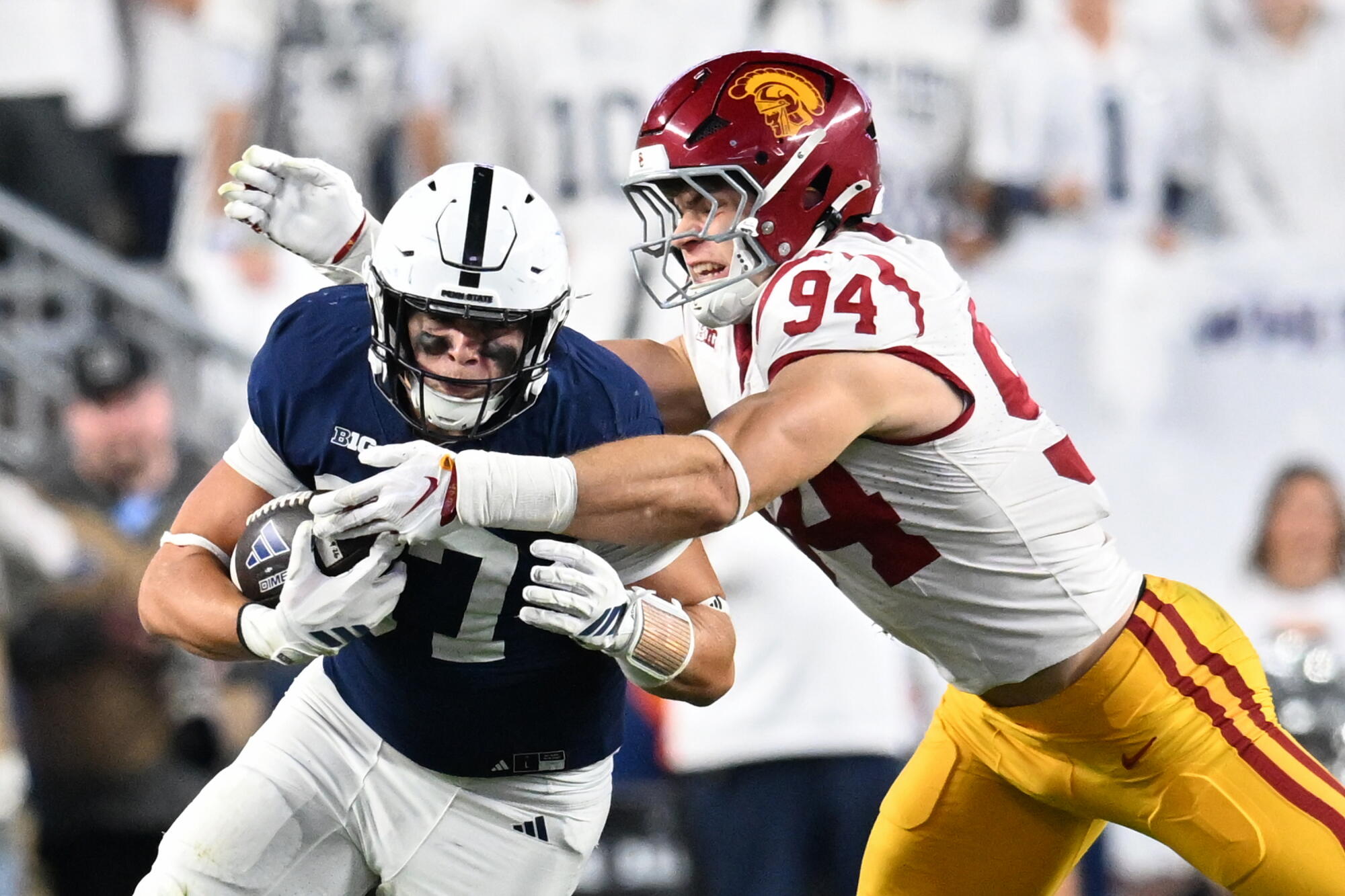 USC defensive end Luke Wafle tackles Penn State tight end Andrew Rappleyea Saturday in State College, Penn.