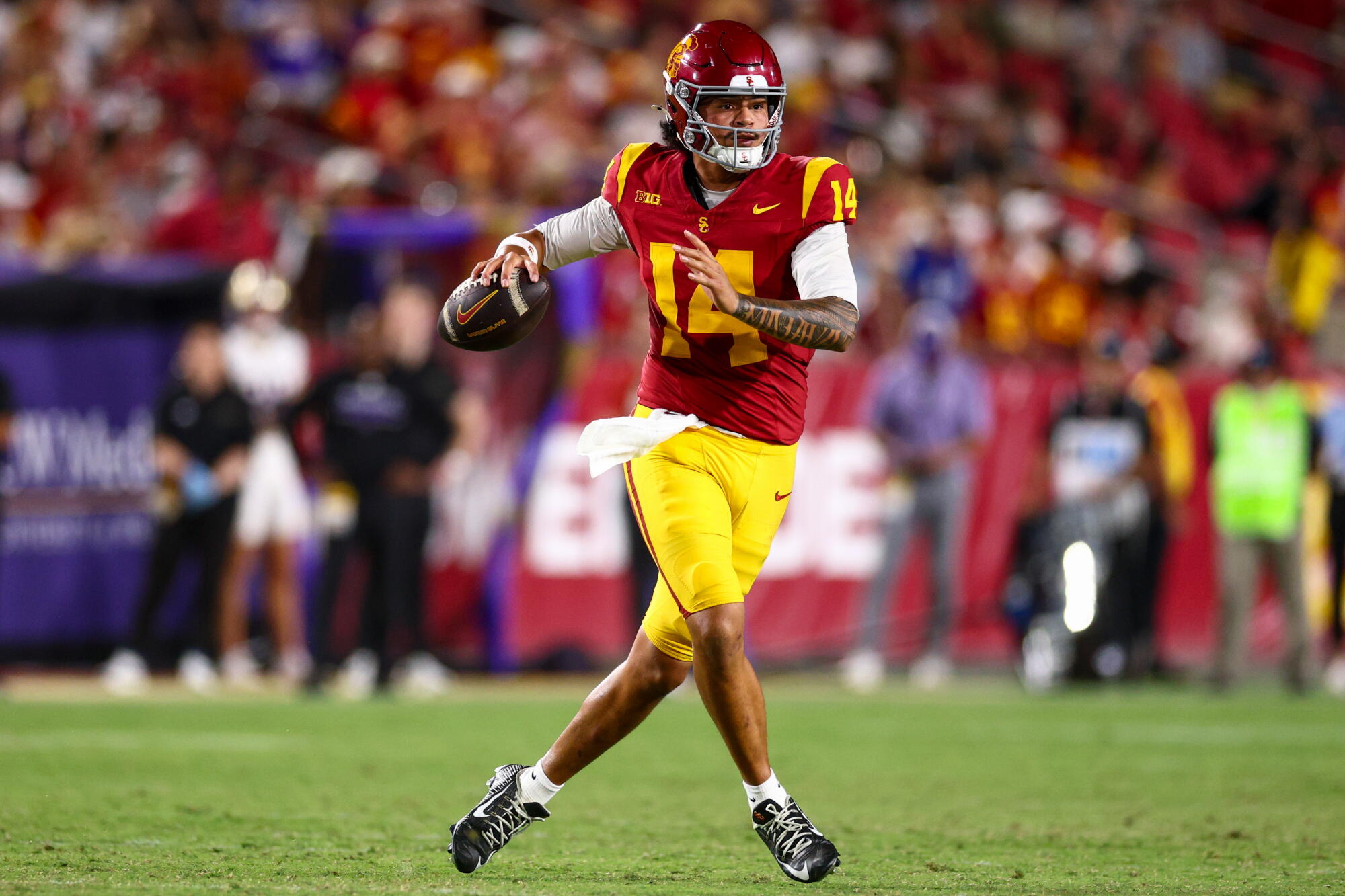 USC quarterback Jayden Maiava scans the field for receiving options during the Trojans' win over Washington.