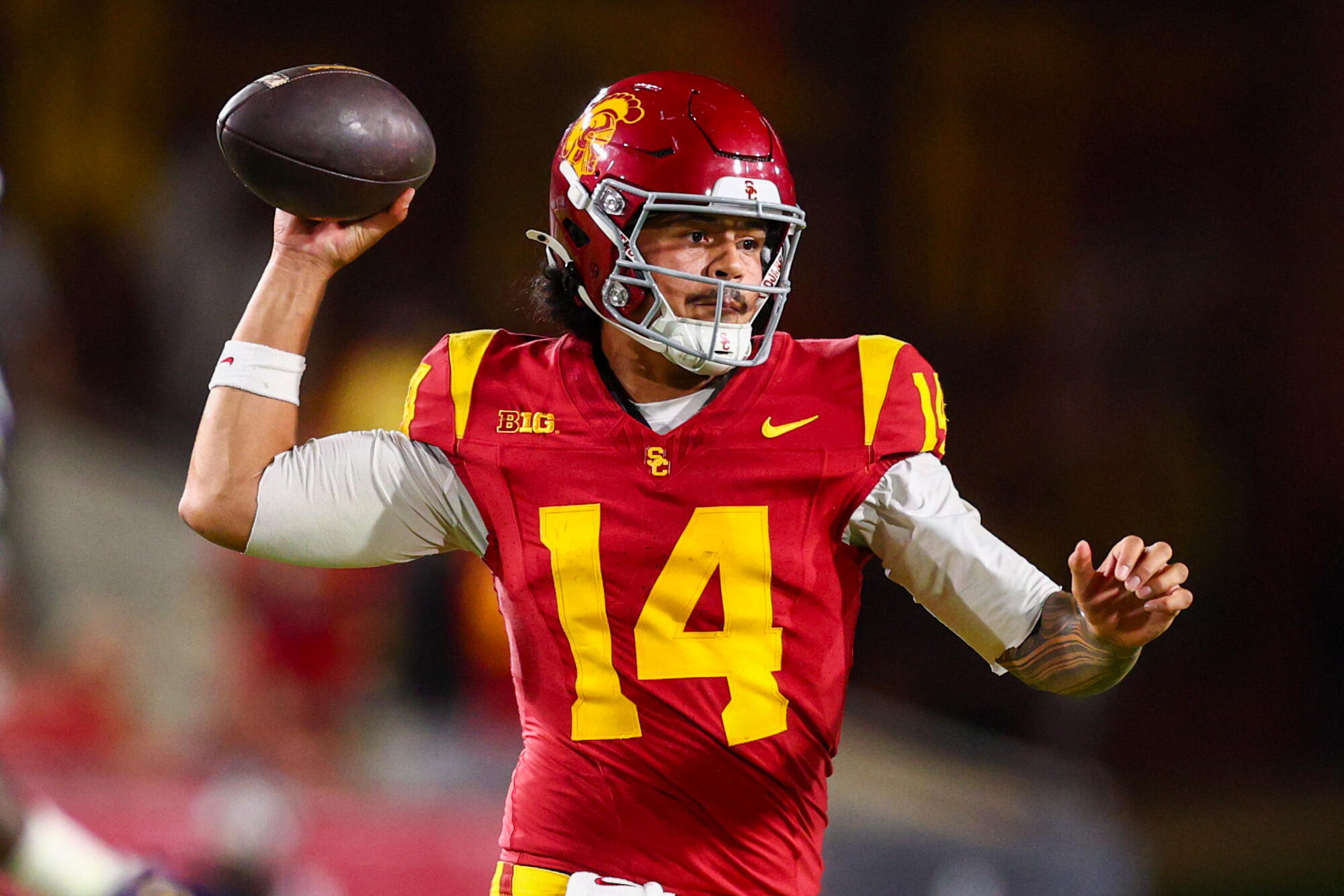 USC quarterback Jayden Maiava looks to pass the ball during a game against Washington at the Coliseum on Saturday.