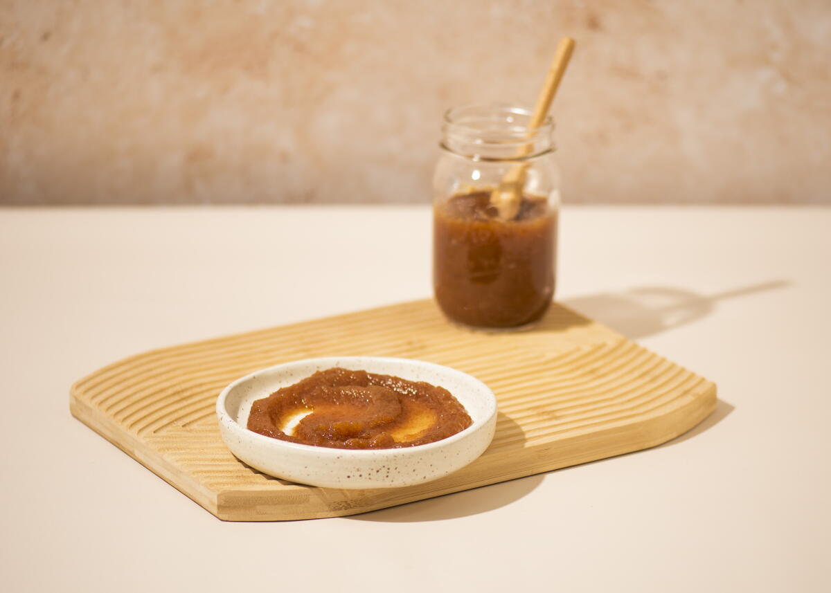 Apple Butter on a plate and inside a jar