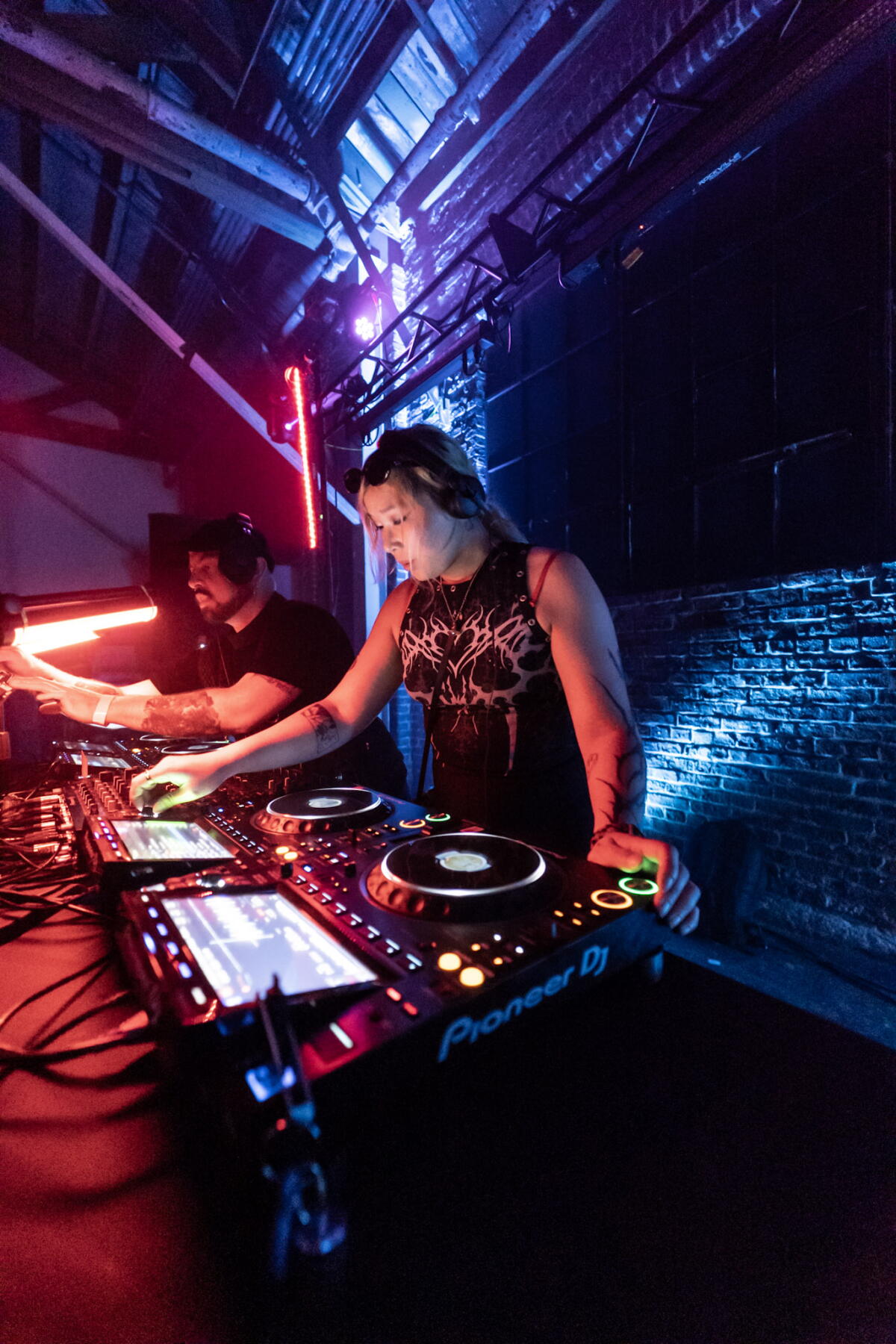 DJs play for a warehouse crowd at Trans*cendent 