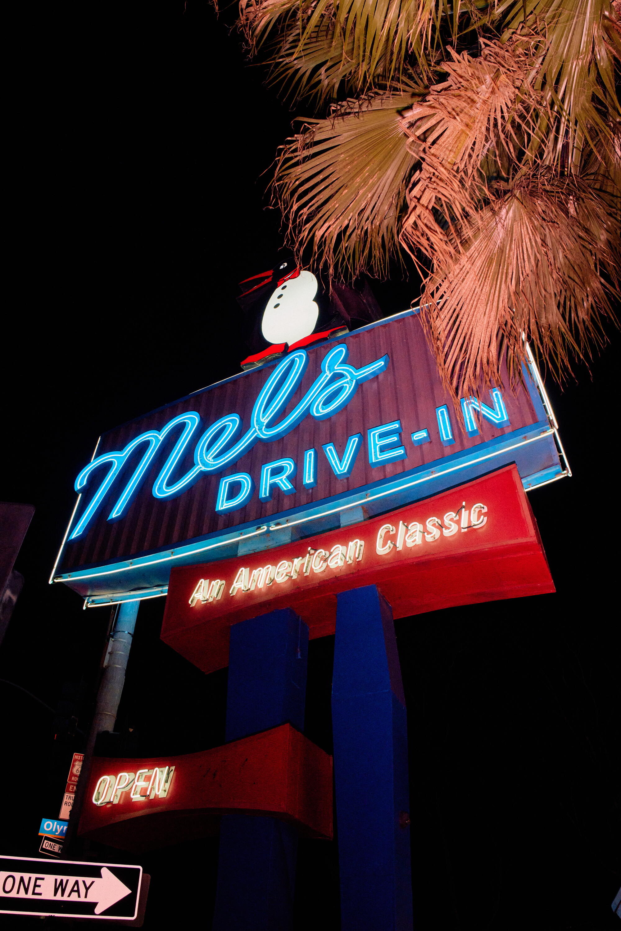 The sign of Mel's Drive-In features a penguin, homage to the coffee shop of yesteryear.