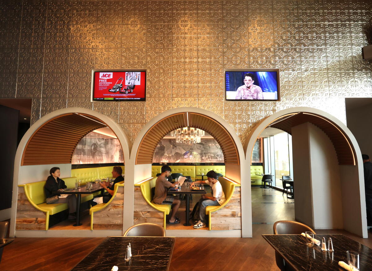 People sit in a hotel restaurant.