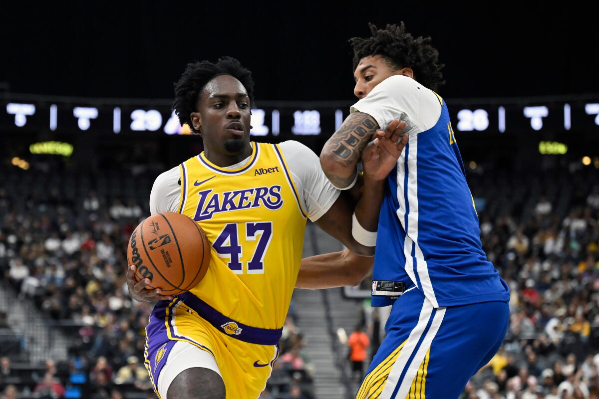 Lakers forward Arthur Kaluma drives the ball against Warriors forward Yaxel Lendeborg during the first half Tuesday.