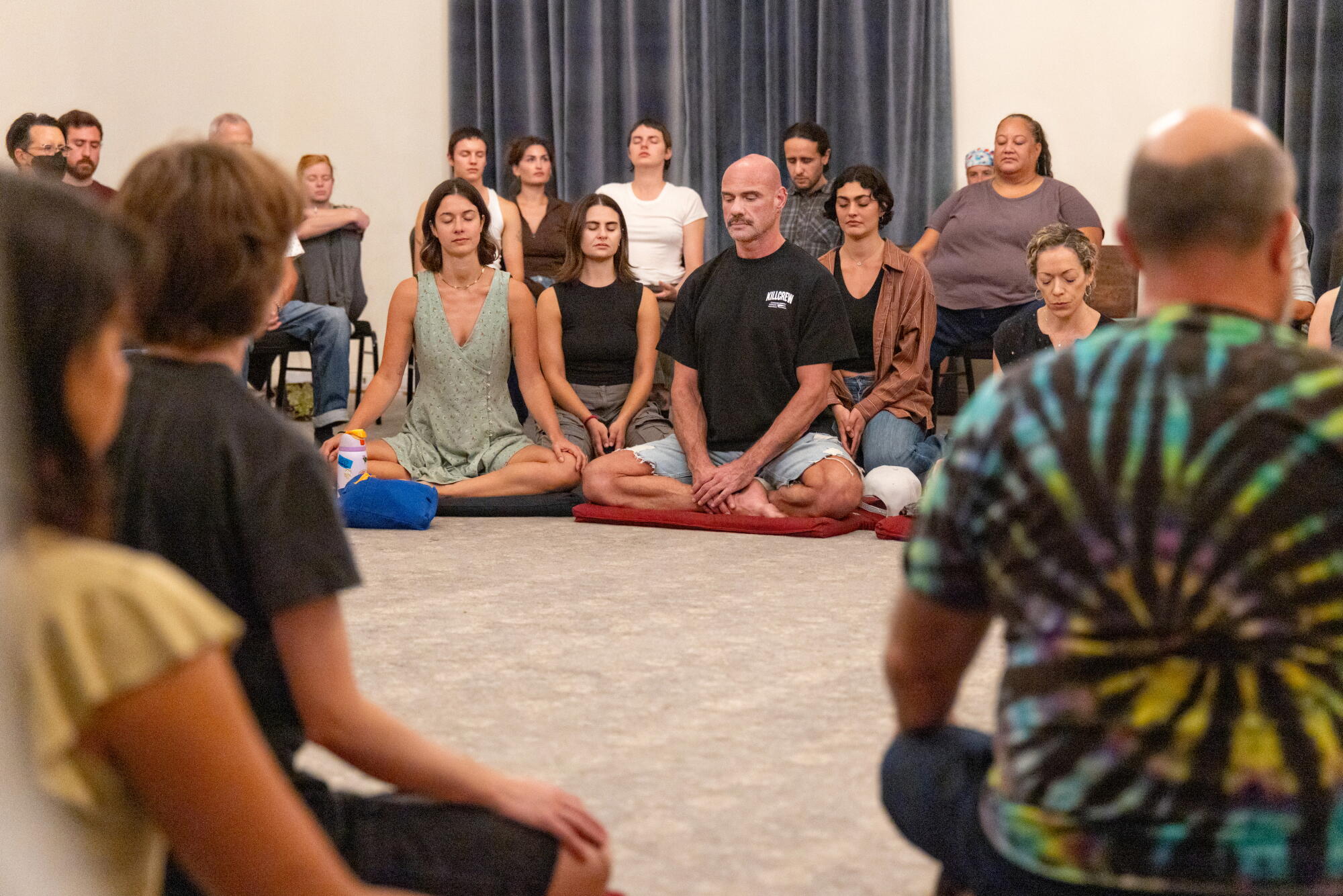 Members of a weekly meditation group at Hollywood Forever Cemetery participate in a guided session
