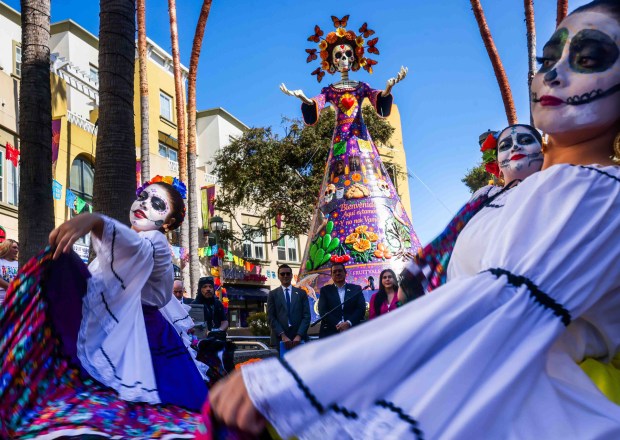 Ballet Folklórico de Fremont High School performs during the official welcome ceremony for La Catrina, a monumental 34-foot sculpture handcrafted in Mexico City and installed in the heart of the Fruitvale district in Oakland, Calif., on Thursday, Oct. 1, 2026. (Ray Chavez/Bay Area News Group)