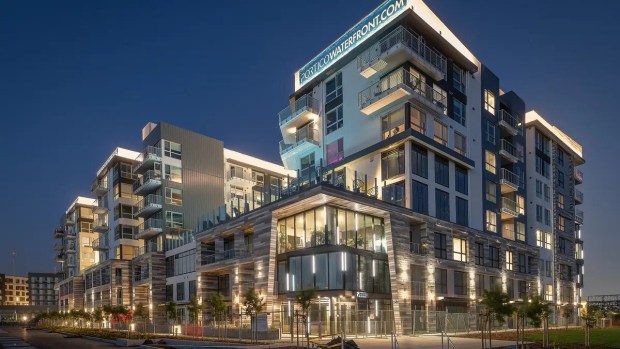 Evening view of Portico Waterfront, an apartment complex at 37 Eighth Avenue in Oakland's Brooklyn Basin neighborhood. (Essex Property Trust)