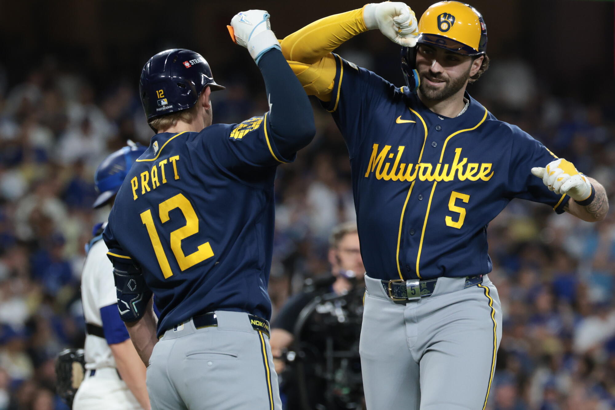 Milwaukee's Garrett Mitchell, right, celebrates with Cooper Pratt after hitting the go-ahead home run.