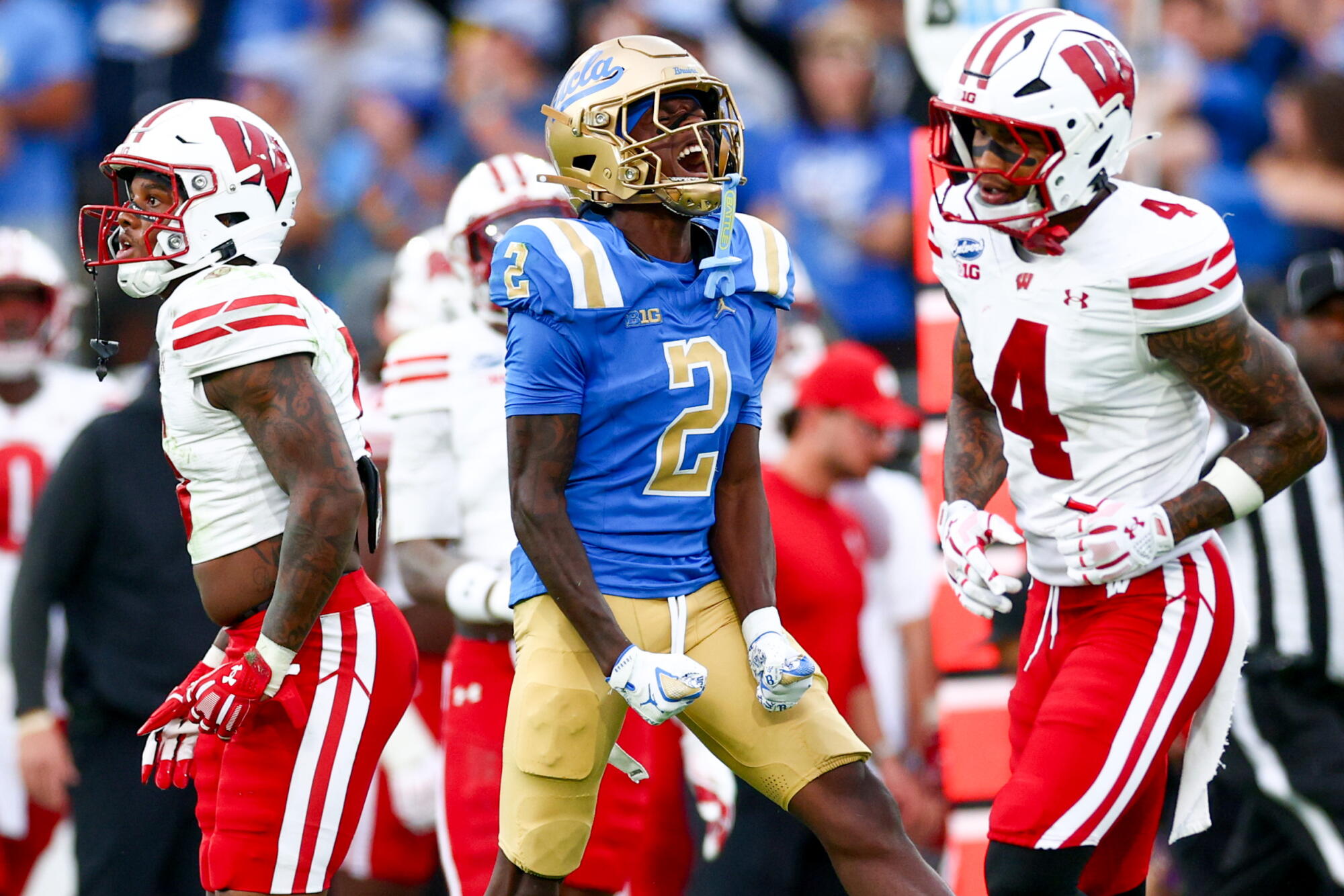 UCLA wide receiver Brian Rowe Jr. celebrates after making a catch against Wisconsin.
