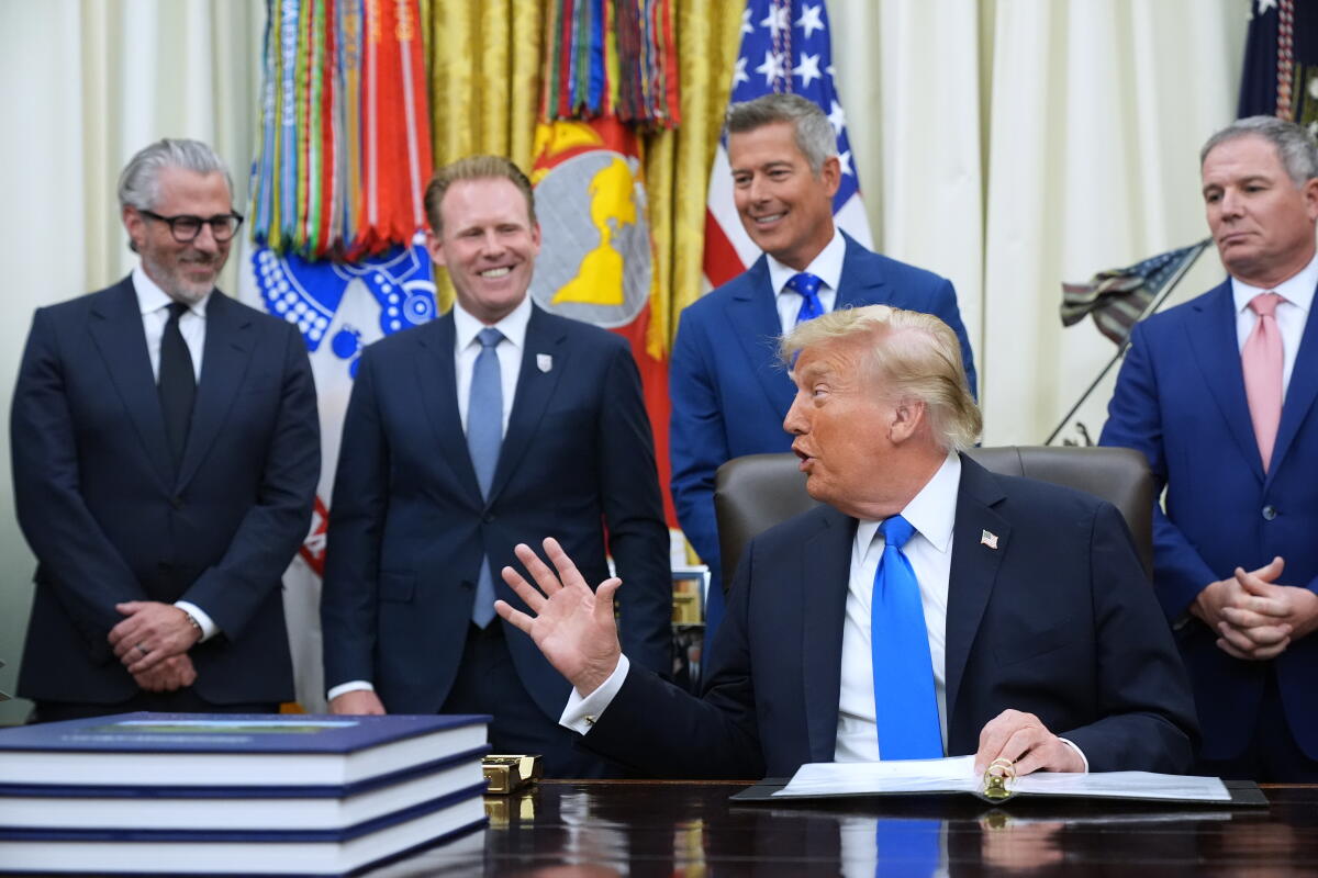 President Trump speaks in the Oval Office during a meeting with travel executives