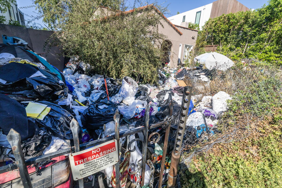 Piles of rubbish outside a house in the Fairfax District.