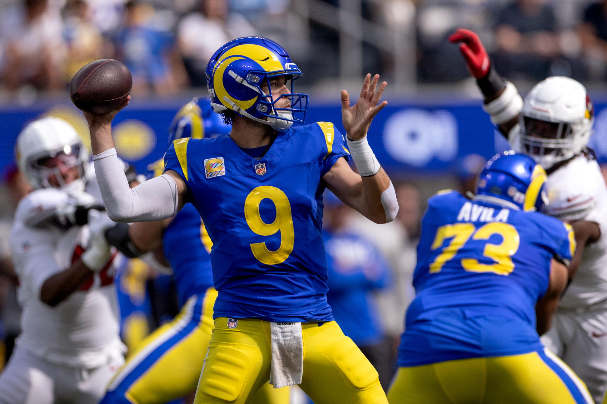 Rams quarterback Matthew Stafford looks to pass the ball against the Cardinals at Sofi Stadium on Sunday.