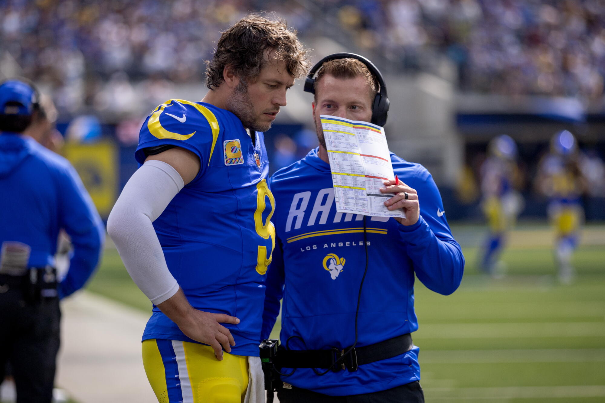 Rams quarterback Matthew Stafford speaks with and coach Sean McVay on the sideline before Sunday's loss to the Cardinals.