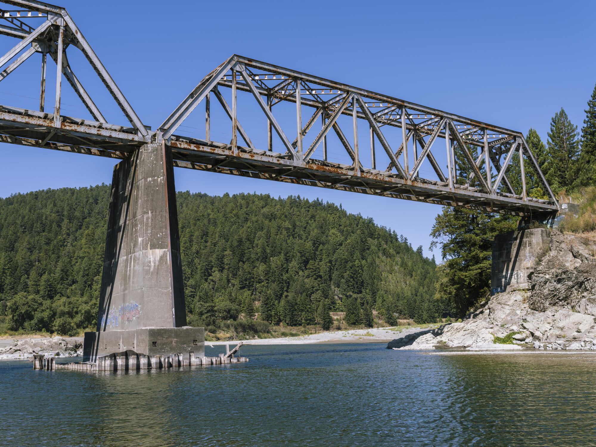 an out-of-commission railroad bridge crossing the Eel River