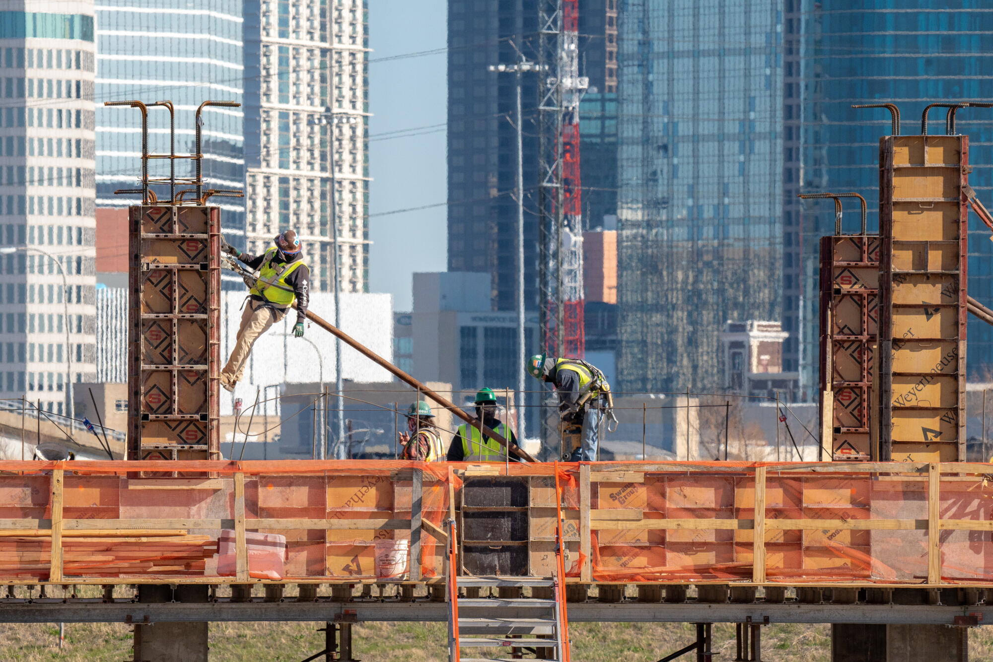 Workers at the Riverfront Development project along the Trinity River