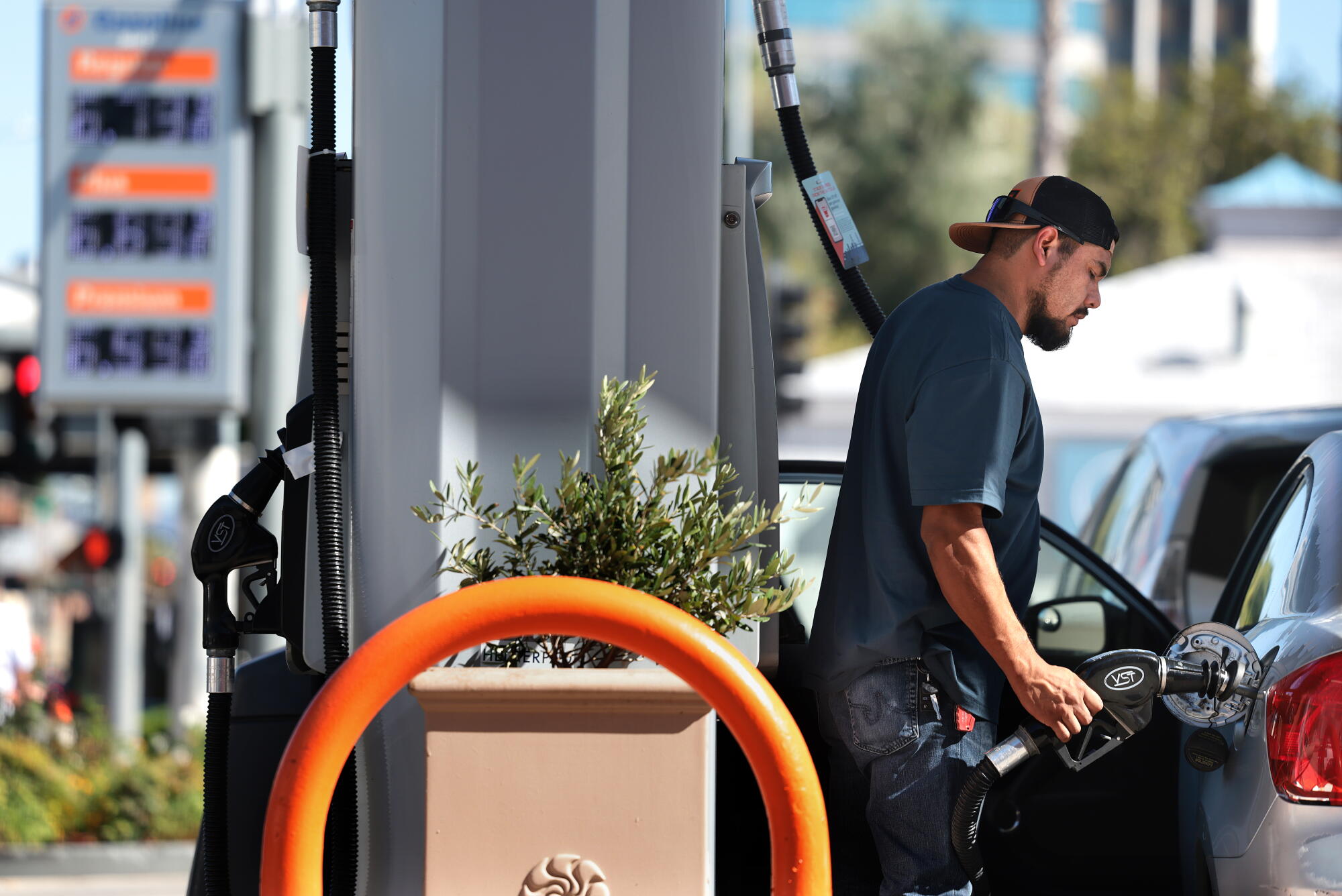 Jesus Salgado of Lincoln Heights puts gas in his tank