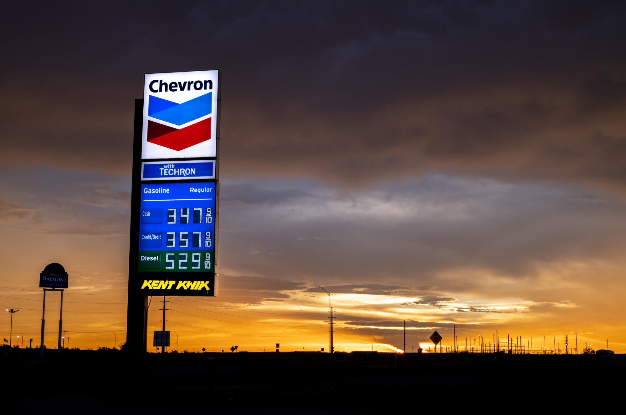 Gas and diesel prices are displayed at a Chevron gas station