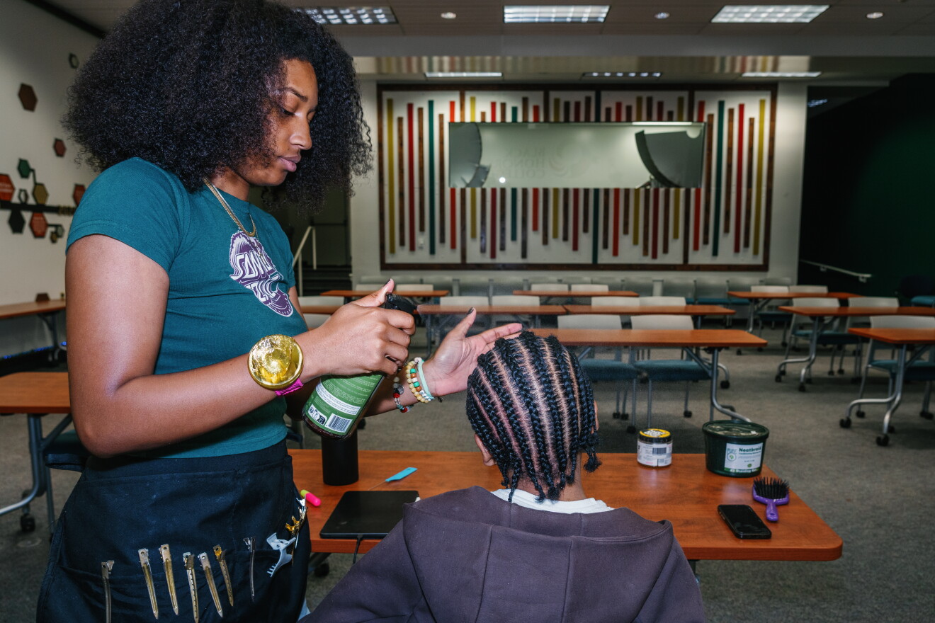 Being part of the Black Honors College has helped Naomi Thrower, a junior, get in touch with her black identity. She runs a natural hair business on campus and says it's helped her develop a creative expression.