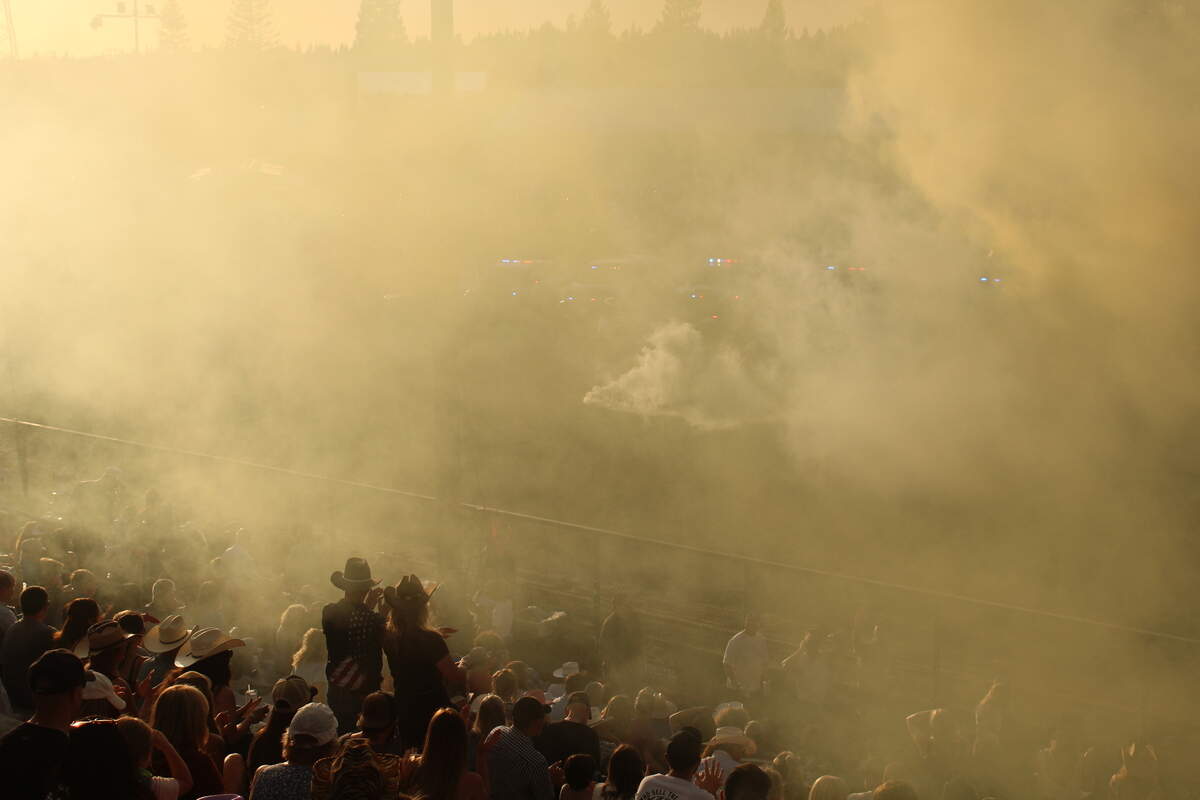 Colored smoke fills the air during an opening performance Oct. 3, 2026 at the Sacramento County Sheriff’s Rodeo