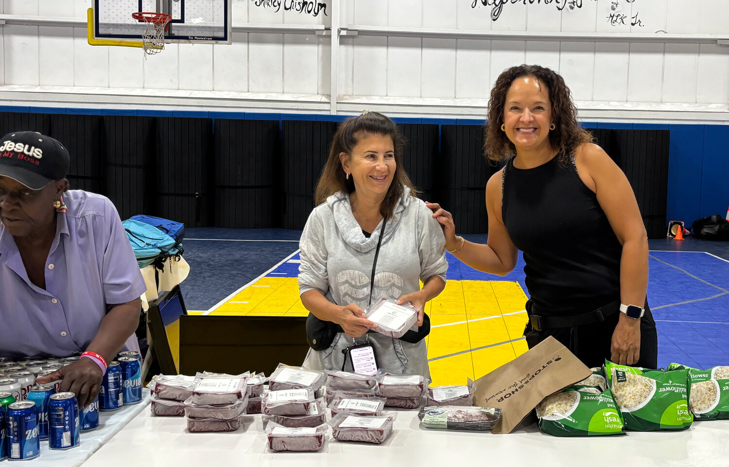 Paola Puig, center, and Silvana DeBellis, right, are some of the 16 Long Beach campus members from CenterPoint who volunteer at Long Beach&rsquo;s MLK Community Center.