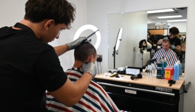 Some students at Long Beach High School are trading pens and pencils for shears and buzzers in Room 208, in the school&rsquo;s new barbering program. Senior Nuri Ipce, left, put his skills to work on Principal Andy Smith.