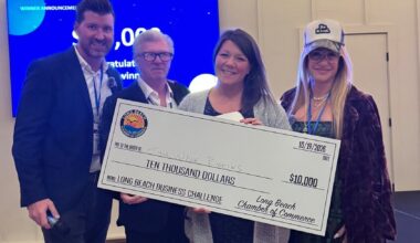 Long Beach Chamber of Commerce vice chairperson John Boland, left, treasurer Ian Danby, and chairperson Leah Tozer-Rosensweig, far right, presented Kate Scotti with a $10,000 grant at Bright Eye Beer Co. as part of the chamber&rsquo;s business challenge.