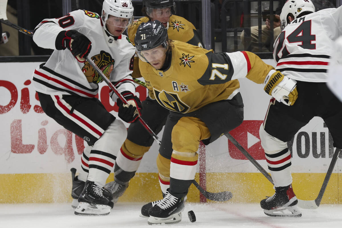 Golden Knights center William Karlsson (71) and Chicago Blackhawks right wing Roman Kantserov ( ...
