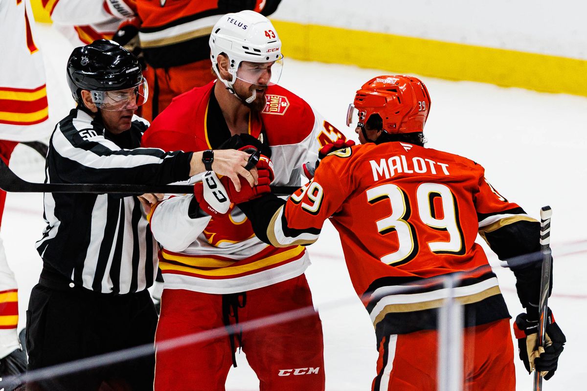 Adam Klapka #43 of the Calgary Flames gets into a fight with Jeff Malott #39 of the Anaheim Ducks during an NHL game against the Anaheim Ducks on October 13, 2026 at Honda Center in Anaheim, California.