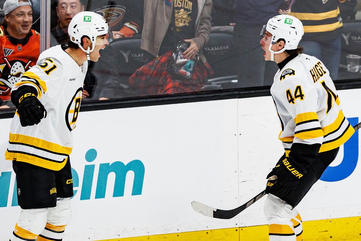 Matthew Poitras #51 of the Boston Bruins celebrates with James Hagens #44 of the Boston Bruins after scoring a goal during an NHL regular season game against the Anaheim Ducks on October 16, 2026 at Honda Center in Anaheim, California. Matthew Poitras #51 of the Boston Bruins celebrates with James Hagens #44 of the Boston Bruins after scoring a goal during an NHL regular season game against the Anaheim Ducks on October 16, 2026 at Honda Center in Anaheim, California.