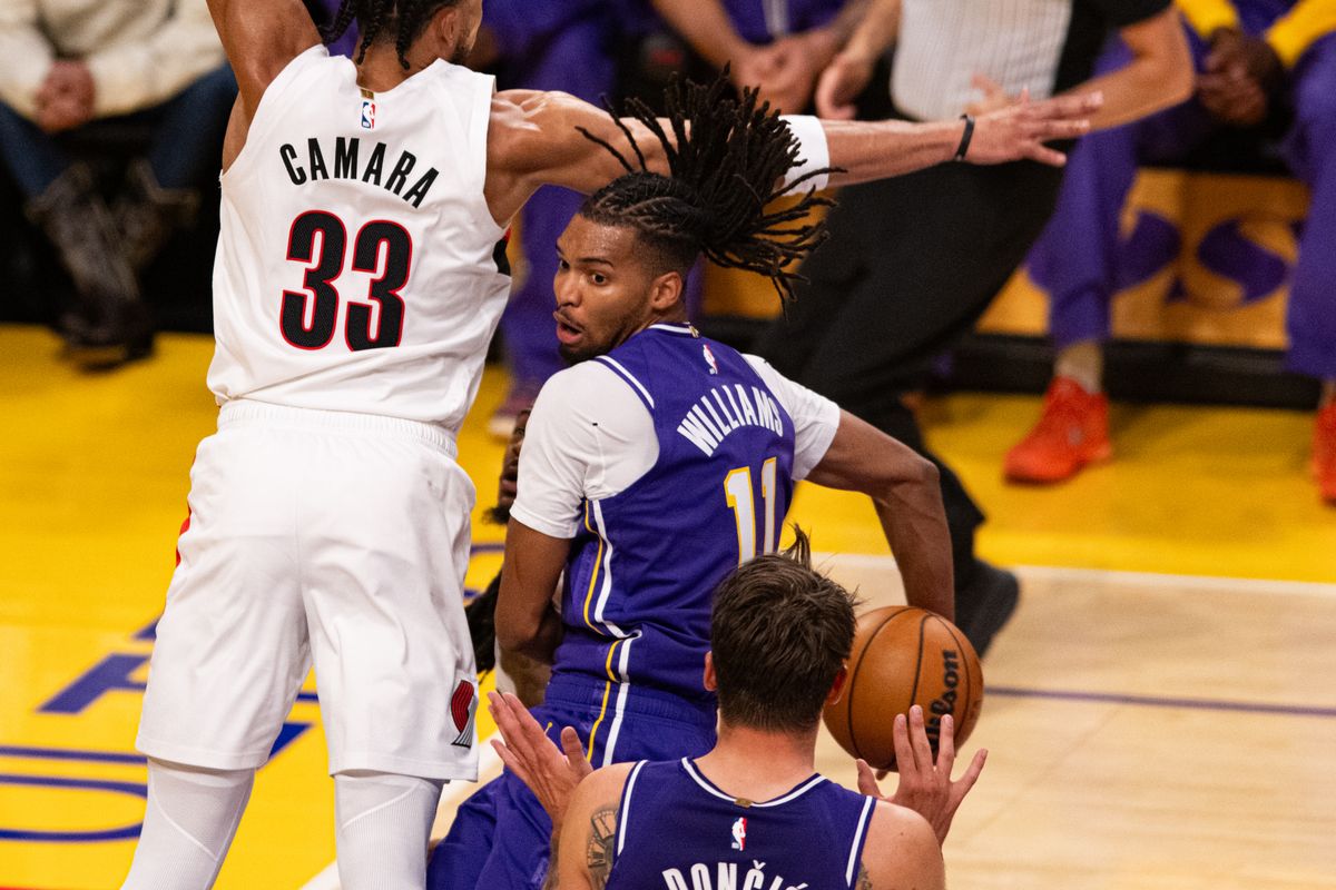 Los Angeles Lakers forward Ziaire Williams (11) makes a behind a back pass to Luka Doncic during an NBA basketball game against Portland Trailblazers, Tuesday, October 27, 2026 in Los Angeles.
