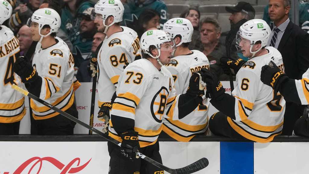 McAvoy scores in his 1st game back from a suspension to lead the Bruins past the Sharks 6-3