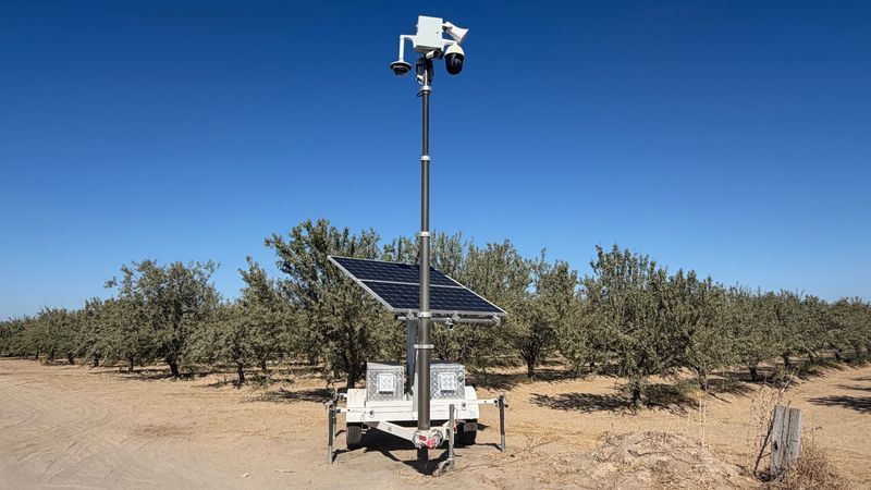 Investigators say cameras mounted on a mobile solar surveillance trailer recorded a man taking pomegranates from trees and filling several bags. (Photo: Fresno County Sheriff's Office)