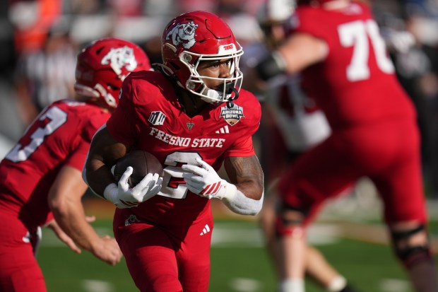 Fresno State running back Rayshon Luke looks for yardage in the first half of the Snoop Dogg Arizona Bowl against Miami (Ohio) on Dec. 27, 2025, in Tucson, Ariz. (AP Photo/Rick Scuteri)
