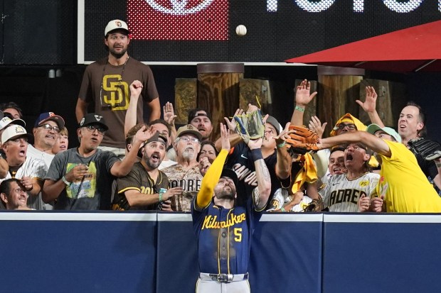 Milwaukee Brewers center fielder Garrett Mitchell catches a ball hit by San Diego Padres' Manny Machado during the eighth inning in Game 4 of baseball's National League Division Series Wednesday, Oct. 7, 2026, in San Diego. (AP Photo/Gregory Bull)