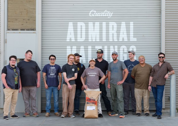 A group photo of Admiral Maltings Co-founders and employees during the last day of operation in Alameda, Calif. on October 2nd, 2026. Pictured from left are Noah Cachuela, Milo Benjamine, Brandon Balassi, Sam Silberstein, Tim Decker, Ron Silberstein, Zack Reinstein, Curtis Davenport, Derek Timm-Brock, Diego Salinas, and Thomas Brenkwitz.(Douglas Despres for Bay Area News Group)