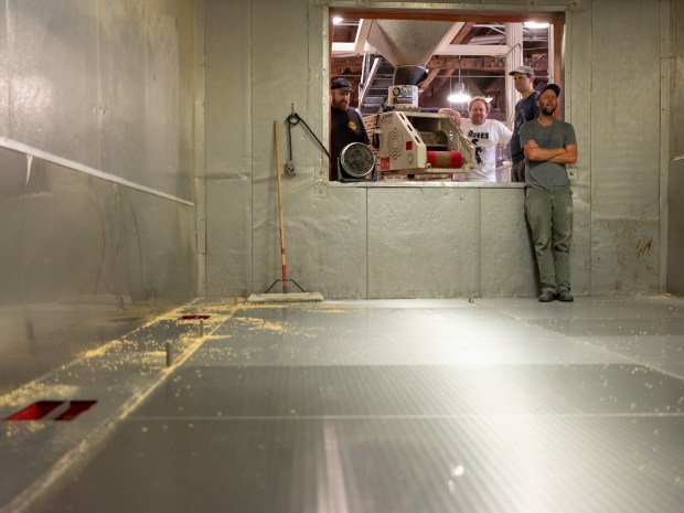 Co-founder Curtis Davenport (far right) takes an emotional moment after shoveling the last ever batch of malts inside the kiln on the last day of operation of Admiral Maltings in Alameda, Calif. on October 2nd, 2026 Also pictured from left are Tim Decker, Kim Sturdavant and Derek Timm-Brock. (Douglas Despres for Bay Area News Group)
