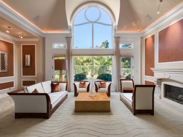 Living room with high ceilings and high windows. 