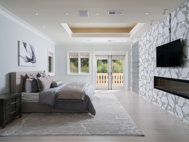 A bedroom suite with a balcony. 