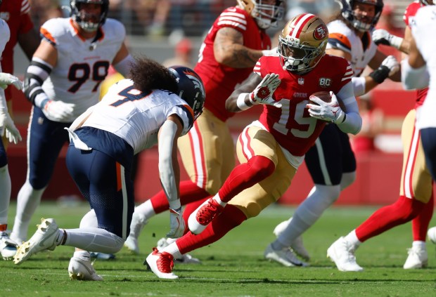 San Francisco 49ers' Deebo Samuel Sr. (19) runs against Denver Broncos' Talanoa Hufanga (9) in the first quarter at Levi's Stadium in Santa Clara, Calif., on Sunday, Oct. 4, 2026. (Nhat V. Meyer/Bay Area News Group)