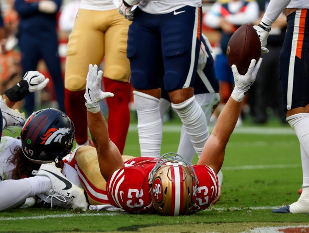 San Francisco 49ers' Christian McCaffrey (23) celebrates his 1-yard touchdown against the Denver Broncos in the fourth quarter at Levi's Stadium in Santa Clara, Calif., on Sunday, Oct. 4, 2026. (Nhat V. Meyer/Bay Area News Group)