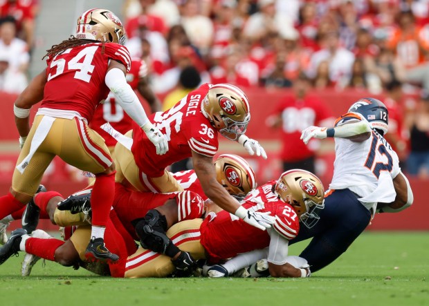 Denver Broncos' RJ Harvey (12) is tackled by the San Francisco 49er defense in the third quarter at Levi's Stadium in Santa Clara, Calif., on Sunday, Oct. 4, 2026. (Nhat V. Meyer/Bay Area News Group)