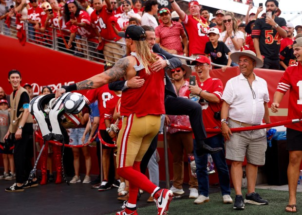 San Francisco 49ers' George Kittle (85) hugs 49ers CEO Al Guido after the 49ers 24-14 win over the Denver Broncos at Levi's Stadium in Santa Clara, Calif., on Sunday, Oct. 4, 2026. (Nhat V. Meyer/Bay Area News Group)