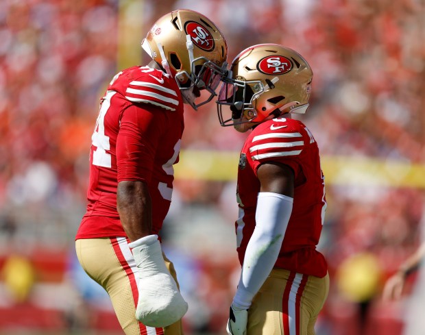 San Francisco 49ers' Malik Mustapha (6) celebrates a play with San Francisco 49ers' Romello Height (94) against the Denver Broncos in the second quarter at Levi's Stadium in Santa Clara, Calif., on Sunday, Oct. 4, 2026. (Nhat V. Meyer/Bay Area News Group)