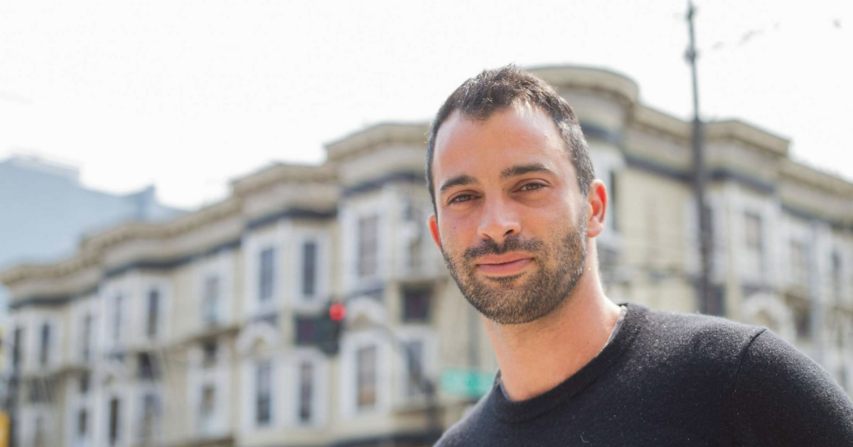 Manny Yekutiel poses for a portrait photo on the streets of San Francisco.