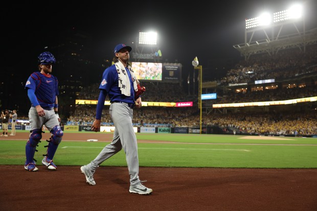 Chicago Cubs pitcher Kevin Gausman and catcher Carson Kelly walk to the dugout before the game against the Padres in Game 2 of their wild-card series on Sept. 30 2026, in San Diego. (Brian Cassella/Chicago Tribune)