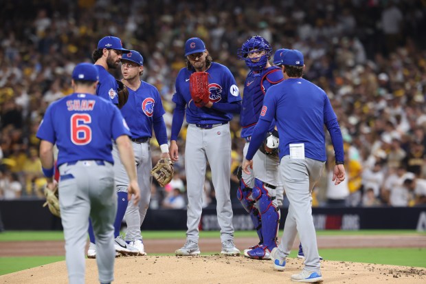 Cubs pitching coach Tommy Hottovy heads to the mound after Cubs pitcher Kevin Gausman gives up a run against the Padres during the second inning of Game 2 of their wild-card series on Sept. 30 2026, in San Diego. (Brian Cassella/Chicago Tribune)